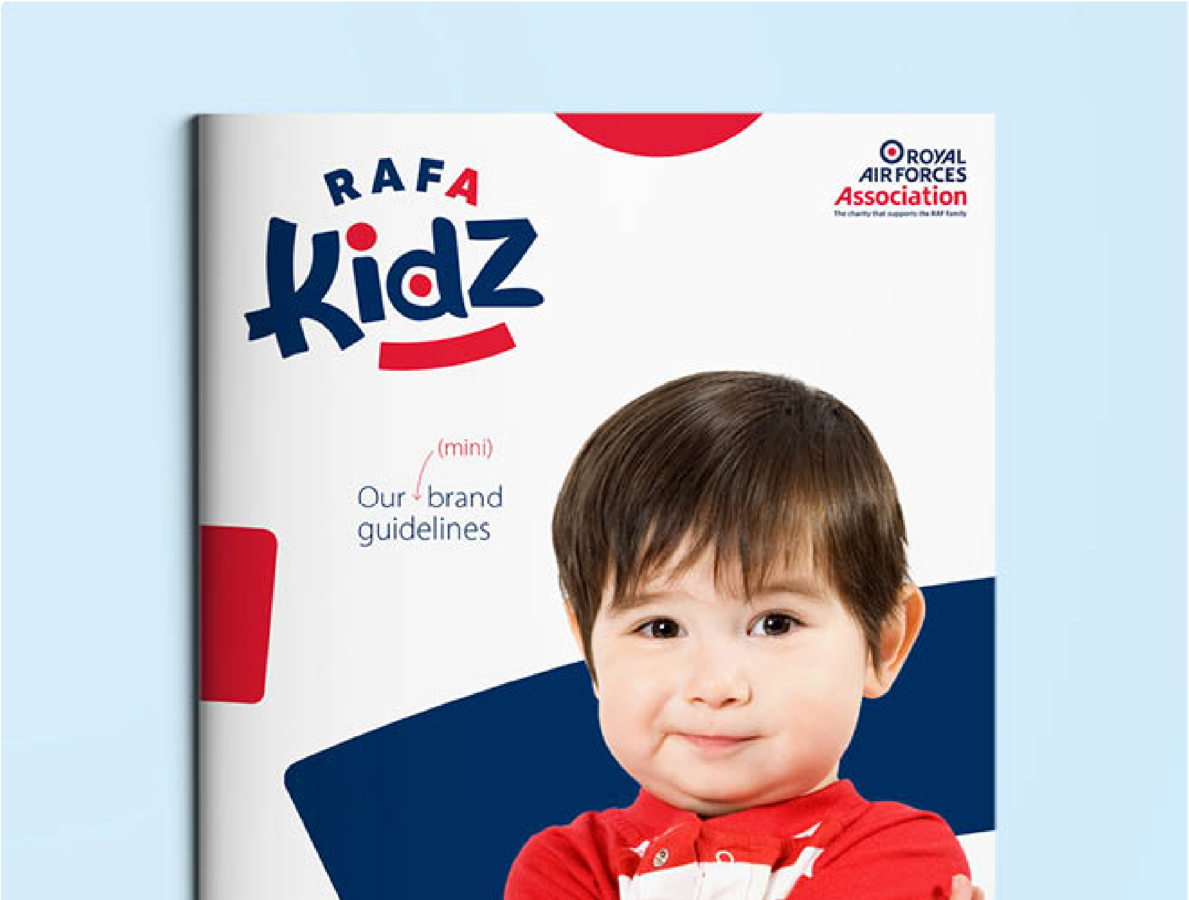Cover of RAFA Kidz mini brand guidelines featuring a small boy with a cute smile and arms folded