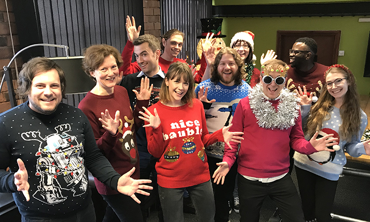 IE team in Christmas jumpers and celebrating UK Charity Week
