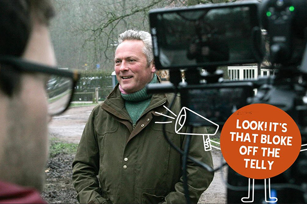 Still of TV presenter Jules Hudson on the set of our video shoot. Illustrated character with a megaphone says "Look! It's that bloke off the telly"