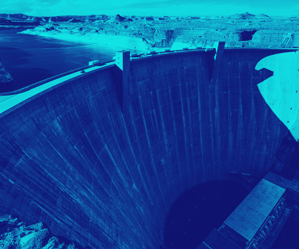 A duotone photo of a large dam in shades of indigo and teal – Royal Academy of Engineering