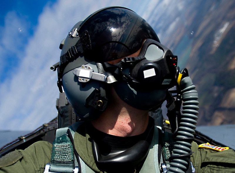 Cranfield University brand photo showing fighter pilot in breathing apparatus and helmet