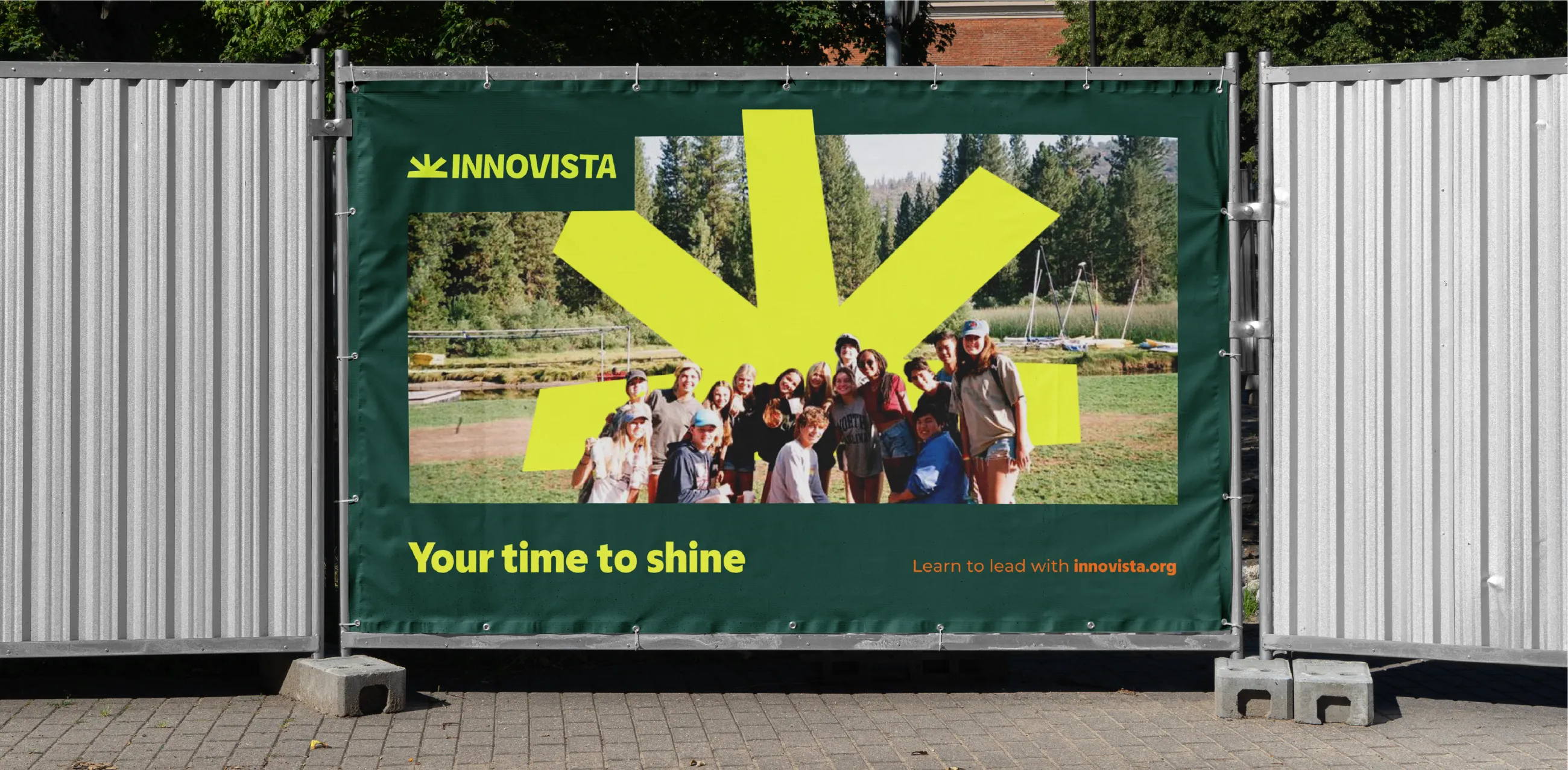 Innovista poster with strapline 'your time to shine'. Group photo of Innovista leaders, with a large yellow sunrise icon behind them.
